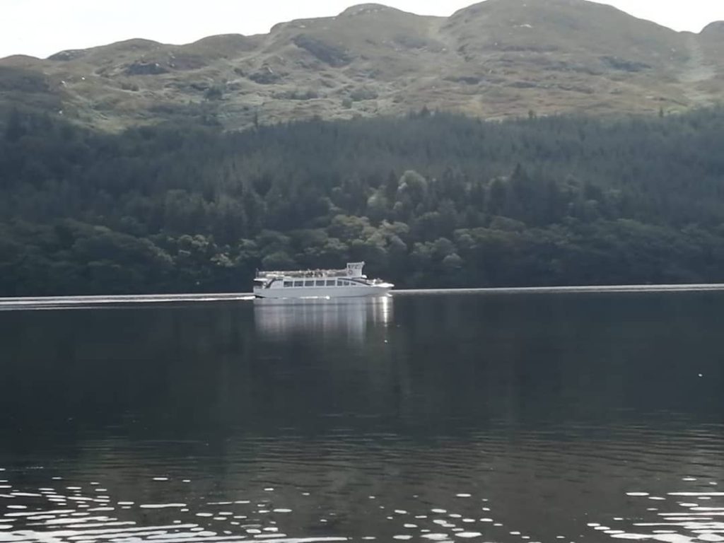 boat crossing a lake